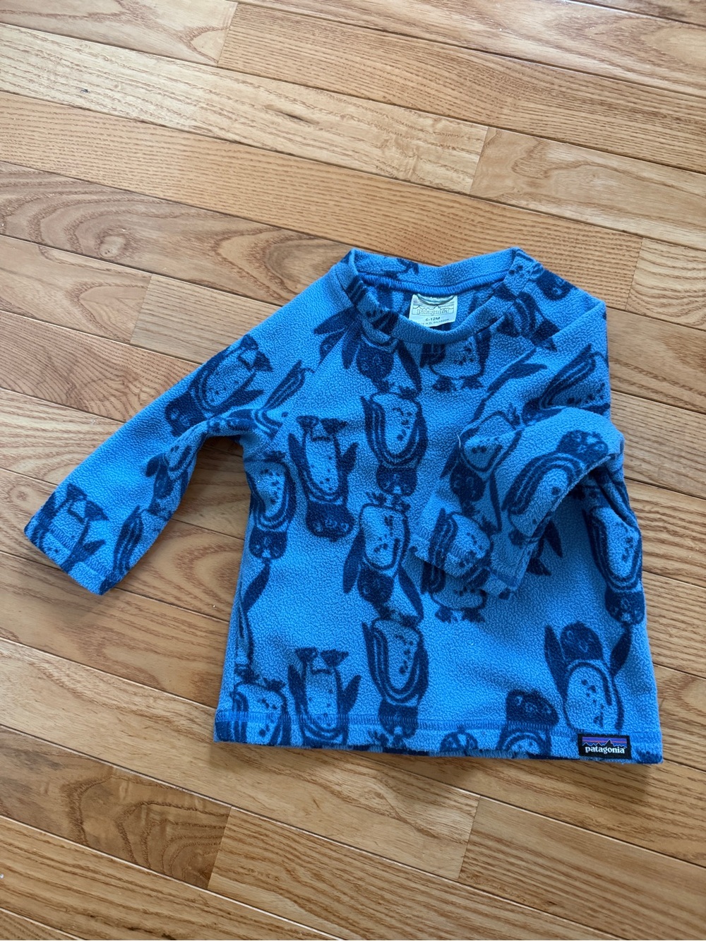 Patagonia Light Blue and Navy Kids Fleece Pullover with Penguin Motif 6-12 month